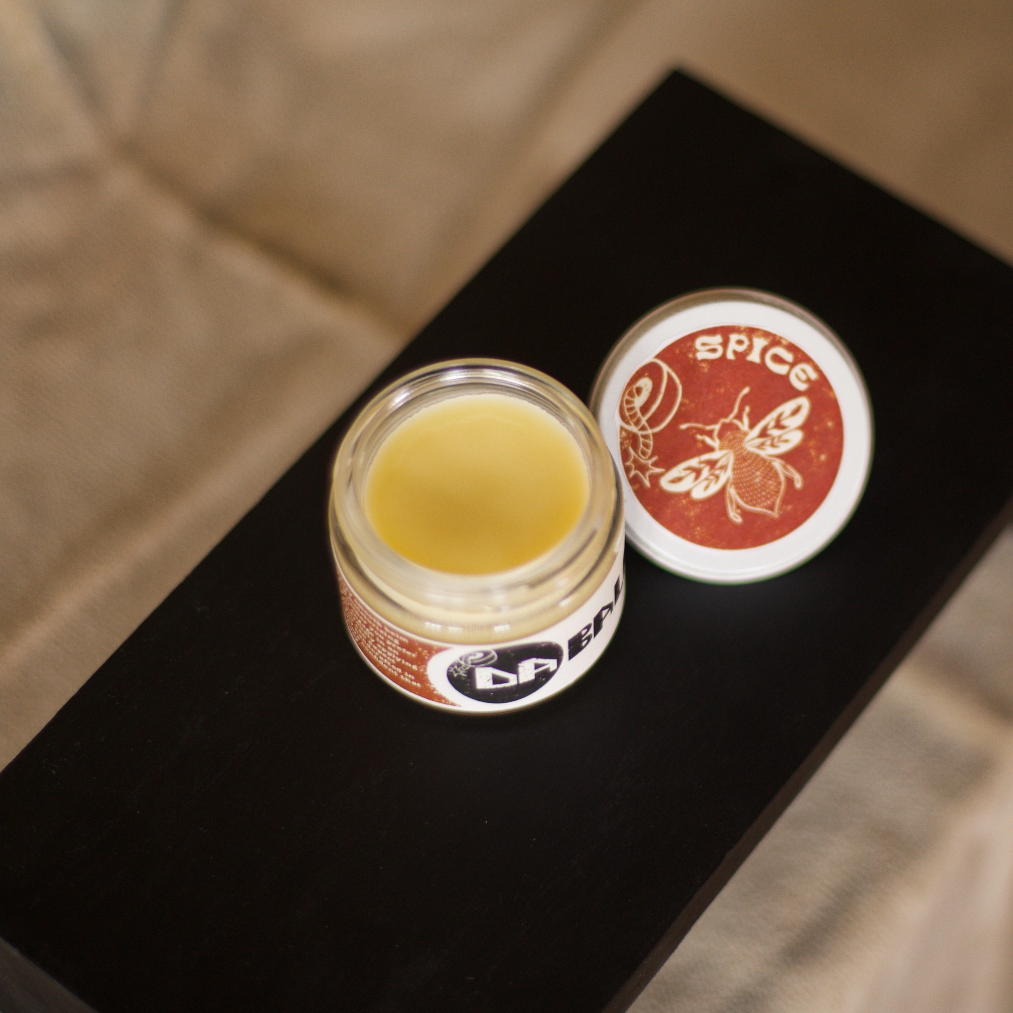 Open jar of Da Balm Spice with lid